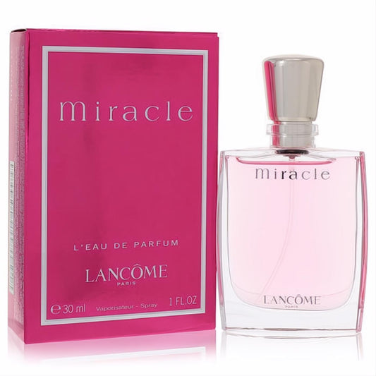 Lancome Miracle 1 oz Eau De Parfum spray. Vibrant pink box and elegant clear bottle with a sleek silver cap.