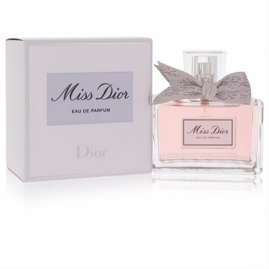 Miss Dior Eau De Parfum 3.4 oz spray in a clear glass bottle with pink liquid, adorned with a shimmering grey bow.