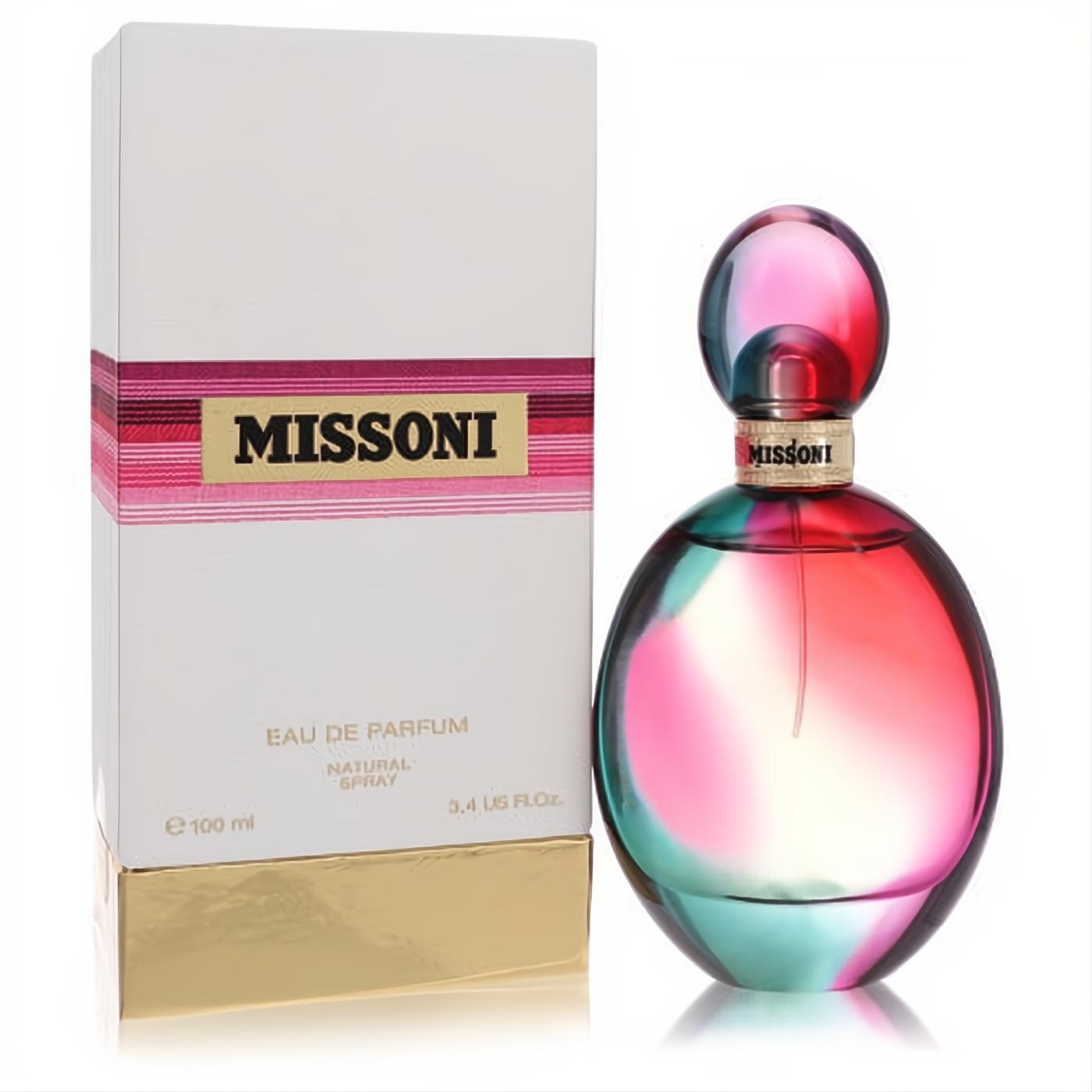 Missoni Eau De Parfum 3.4 oz: captivating pink and teal gradient glass bottle with gold accents, next to its elegant white and gold box.