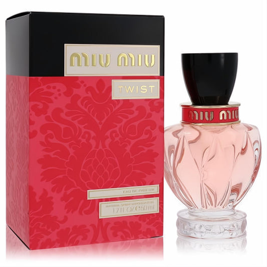 Miu Miu Twist 1.7 oz EDP. Elegant pleated glass bottle with black cap & gold details, next to its vibrant red damask box.