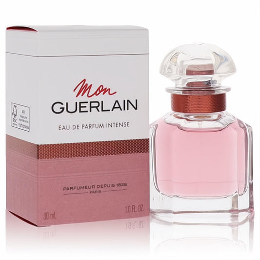 Mon Guerlain Intense 1 oz women's EDP. Clear glass bottle with pink liquid, faceted cap, rose gold band, and elegant white/rose gold box.