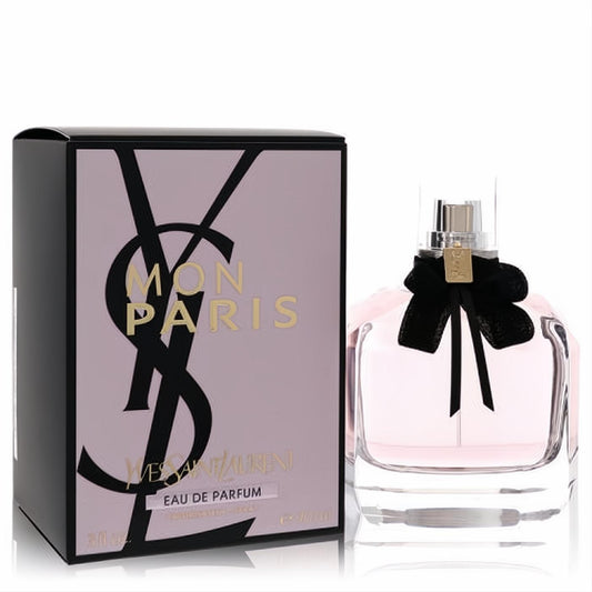 Elegant YSL Mon Paris 3.04 oz Eau De Parfum. Clear bottle with soft pink liquid, chic black bow, and stylish pink & black box.