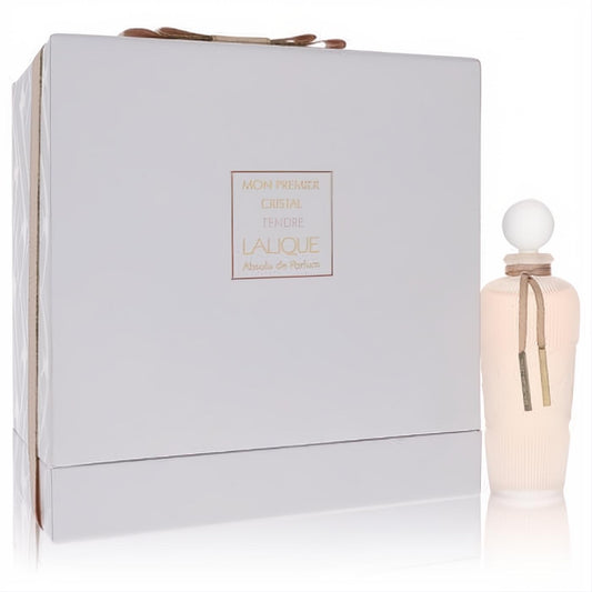 Elegant Lalique Mon Premier Cristal Tendre perfume gift set. White embossed box, frosted peach bottle with ribbed design and ribbon.