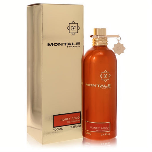 Captivating Montale Honey Aoud 3.4oz EDP. Amber metallic bottle with gold cap and charm, displayed with its elegant gold box.