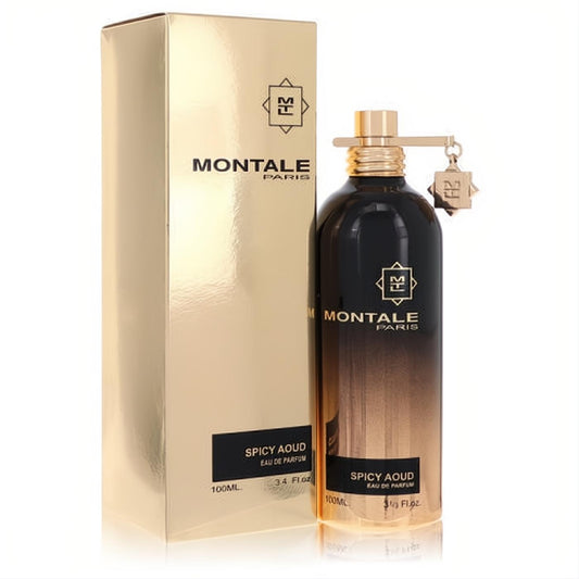 Montale Spicy Aoud 3.4 oz unisex EDP. Luxurious black-to-gold ombre bottle with a sleek gold cap and charm, beside its matching gold box.