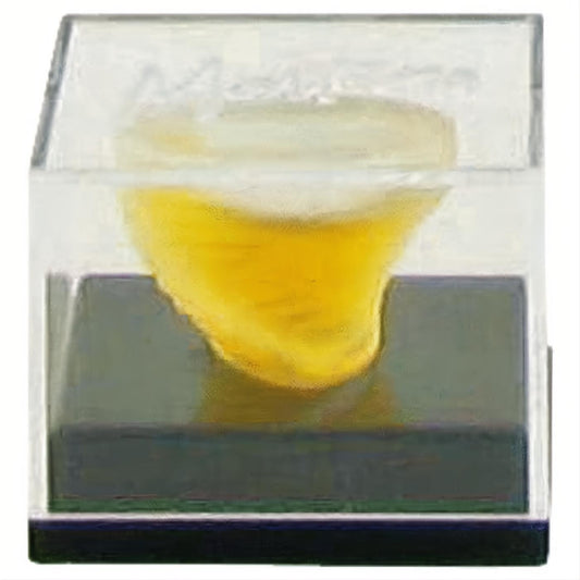 MontanaMini EDT .07 oz: Unique yellow-gold sculptural bottle in a clear acrylic display box, perfect for romantic wear.
