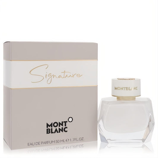 Montblanc Signature 1.7 oz EDP for women. Modern white faceted bottle with gold Montblanc cap, beside its elegant grey and gold box.