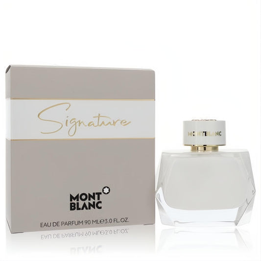 Luxurious Montblanc Signature 3 oz EDP in a modern white faceted glass bottle with gold cap, beside its elegant beige box.