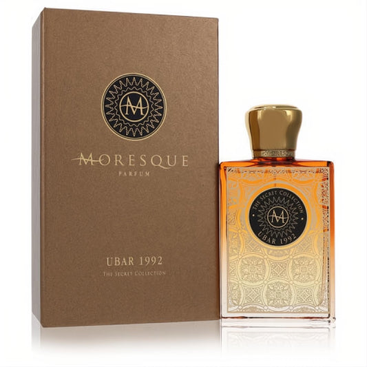 Exquisite Moresque Ubar 1992 unisex perfume, 2.5 oz. Amber bottle with intricate gold pattern, elegant cap, and coordinating bronze box.