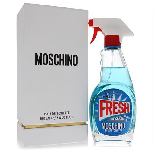 Moschino Fresh Couture 3.4 oz Eau De Toilette. Iconic blue spray bottle with red nozzle, next to its elegant white and gold box.