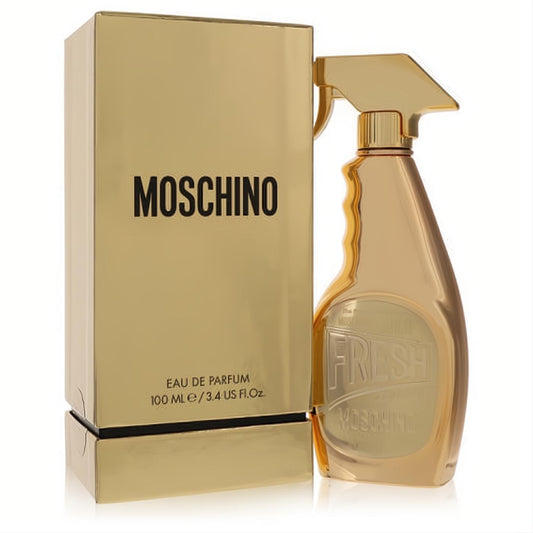 Moschino Fresh Gold Couture 3.4 oz EDP. Dazzling gold cleaning spray bottle and box, a captivating women's perfume.