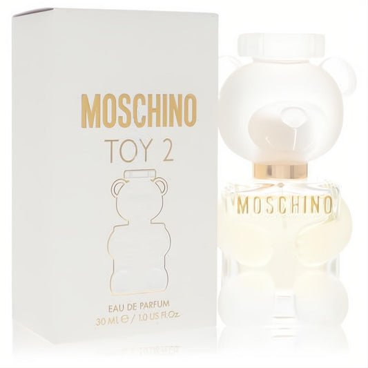 Moschino Toy 2 1 oz women's Eau De Parfum, showcasing its iconic frosted glass teddy bear bottle and elegant white branded box.
