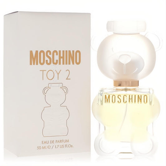 Moschino Toy 2 1.7 oz Eau De Parfum. Iconic clear glass teddy bear bottle with frosted white cap, gold accents, and matching branded box.