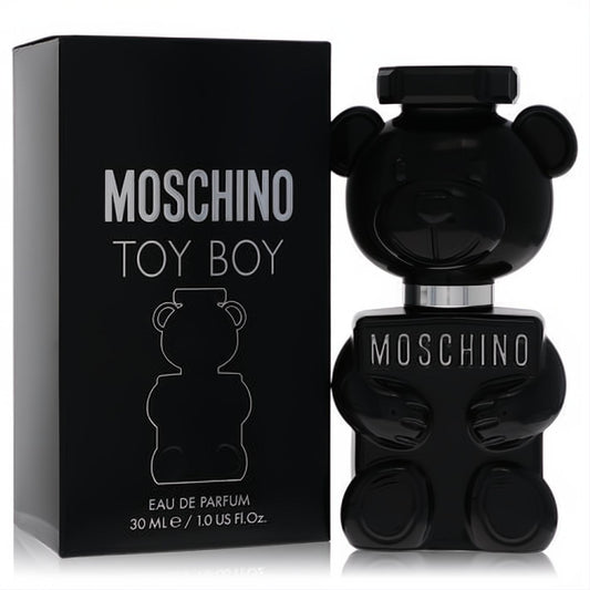 Moschino Toy Boy 1 oz Eau De Parfum: a bold black teddy bear bottle with silver details, beside its matching sleek black box.