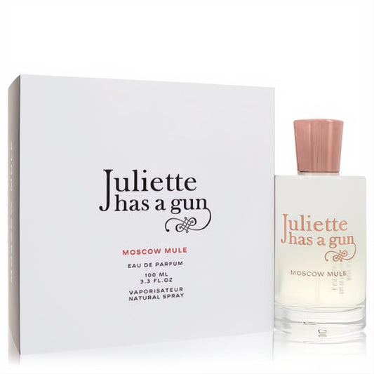 Elegant Juliette Has a Gun Moscow Mule 3.3 oz EDP spray in a clear glass bottle with a chic rose gold cap, next to its crisp white box.