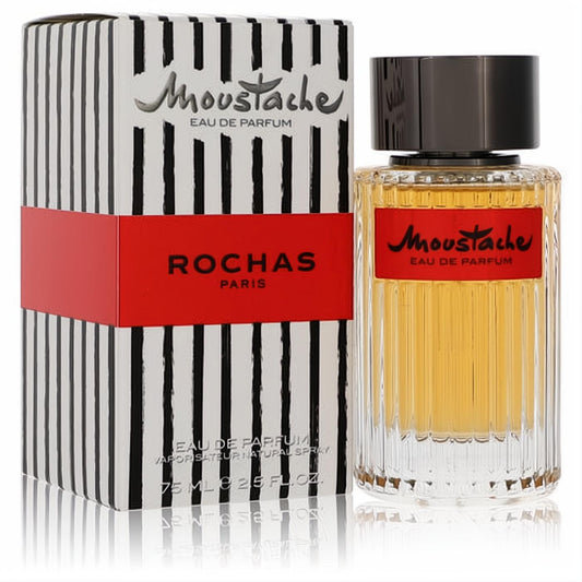Moustache by Rochas 2.5 oz men's Eau De Parfum. Amber liquid in a ribbed glass bottle, beside its striking black striped box with a red band.