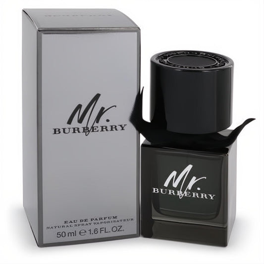 Mr. Burberry Eau de Parfum 1.6 oz men's fragrance. Sleek dark glass bottle with a black textured cap and stylish ribbon, beside its silver box.