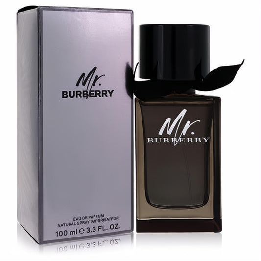 Burberry Mr Burberry 3.3 oz Eau De Parfum for men. Dark amber bottle with black cap and ribbon, next to a sleek silver box.