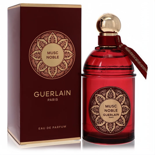 Guerlain Musc Noble 4.2 oz Eau de Parfum. Stunning deep red bottle with ornate gold cap, ribbon, and matching luxury box.