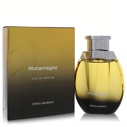 Mutamayez Swiss Arabian unisex Eau De Parfum spray. Bold gold-to-black gradient bottle and matching box for a captivating scent.