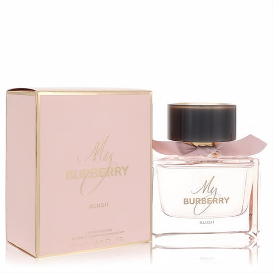 My Burberry Blush 3 oz Eau De Parfum spray. Elegant clear glass bottle with pink ribbon, beside its matching blush pink and gold box.