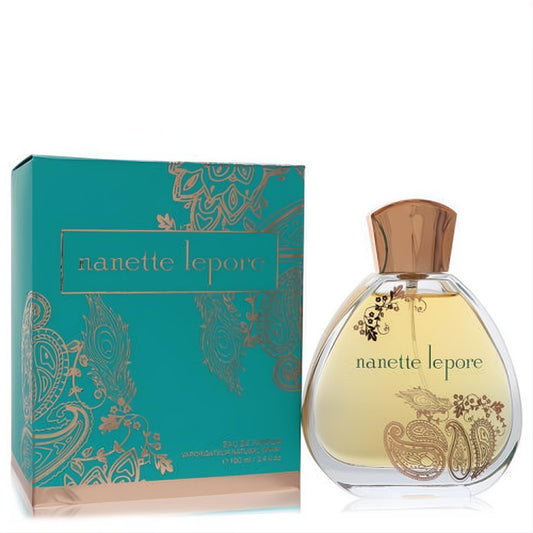 Discover Nanette Lepore 3.4 oz EDP spray: a clear, elegant bottle with gold paisley designs, rose gold cap, and matching teal box.