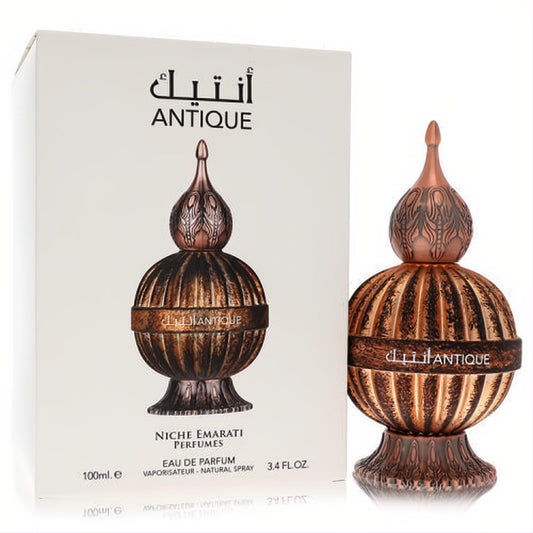 Exquisite Niche Emarati Antique Lattafa 3.4 oz unisex EDP. Ornate bronze globe bottle with intricate finial and white packaging.