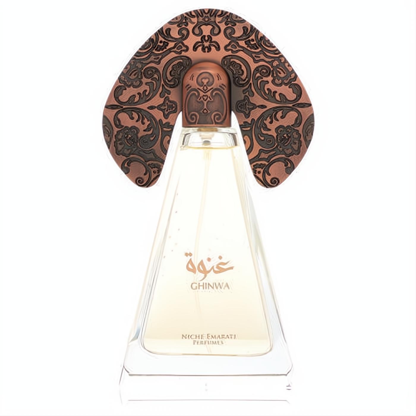 Niche Emarati Ghinwa 3.4 oz unisex perfume. Clear triangular bottle with a striking, ornate bronze cap featuring intricate dark filigree.