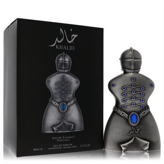 Bold Niche Emarati Khalid 2.7 oz unisex EDP. Unique dark metallic warrior bottle with striking blue gems, beside its sleek black box.
