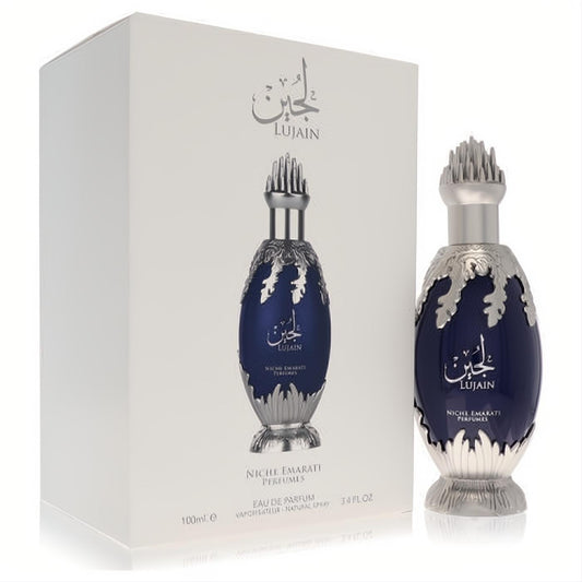 Exquisite Niche Emarati Lujain 3.4 oz unisex EDP. Features a luxurious navy blue bottle with ornate silver accents and spiky cap, with its white box.