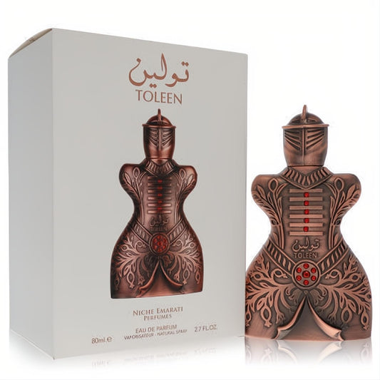 Niche Emarati Toleen 2.7 oz unisex perfume. Unique bronze warrior armor bottle with intricate details and red accents.