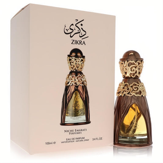 Luxurious Niche Emarati Zikra 3.4 oz unisex EDP. Ornate bronze & gold filigree bottle next to its elegant beige box.
