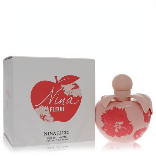Elegant Nina Fleur by Nina Ricci 2.7 oz EDT. Pink apple bottle with vibrant red floral design, beside its white branded box.
