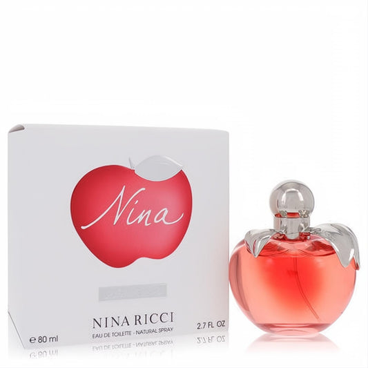 Charming Nina Ricci Nina 2.7 oz Eau De Toilette. Apple-shaped bottle with pink fragrance, silver details, and elegant white box.