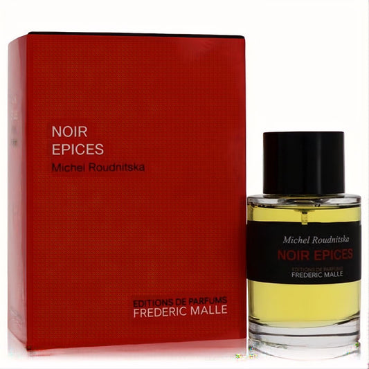 Bold Frederic Malle Noir Epices 3.4 oz EDP. Iconic clear glass bottle with amber liquid, black cap, and deep red textured box.