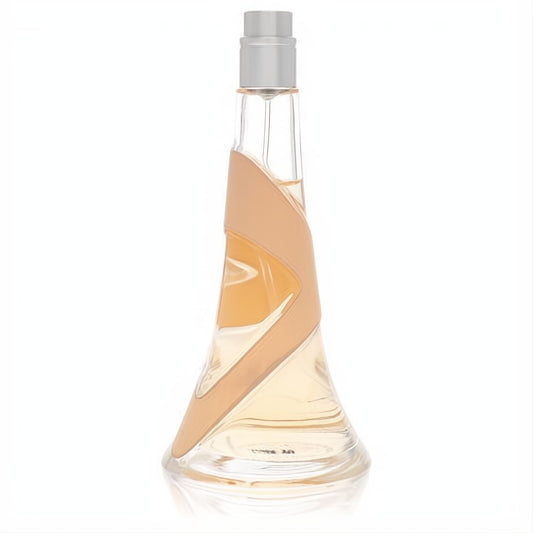 Nude by Rihanna Eau De Parfum in a sleek clear glass bottle with warm amber liquid and a signature nude R-shaped band.