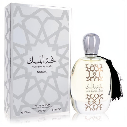 Nukhbat Al Musk by Nusuk 3.4 oz unisex EDP. Clear glass bottle with silver cap, black tassel, and distinctive white geometric box.