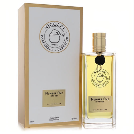 Experience Nicolai Number One Intense Eau De Parfum, 3.4 oz. Elegant clear glass bottle, gold cap, and luxurious white & gold packaging.