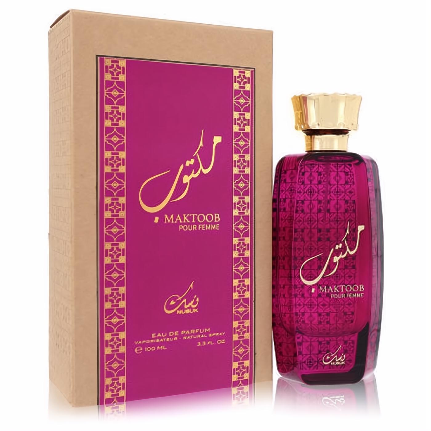 Exquisite Nusuk Maktoob 3.3 oz Eau De Parfum. Vibrant magenta bottle with gold Arabic calligraphy and elegant patterned box.