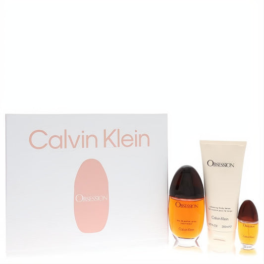 Calvin Klein Obsession women's fragrance gift set: amber EDP spray, body lotion, and mini perfume. Elegant white box with peach branding.