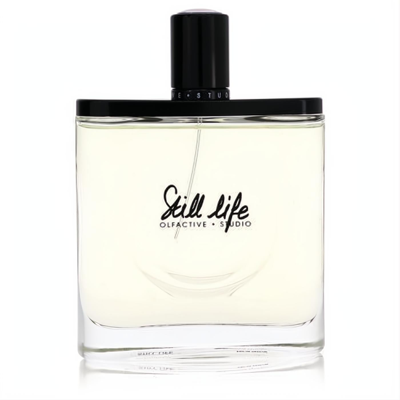 Olfactive Studio Still Life unisex EDP. Clear glass bottle with pale amber liquid, sleek black cap, and elegant black script.