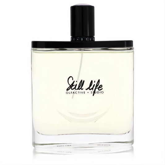Olfactive Studio Still Life unisex EDP. Clear glass bottle with pale amber liquid, sleek black cap, and elegant black script.