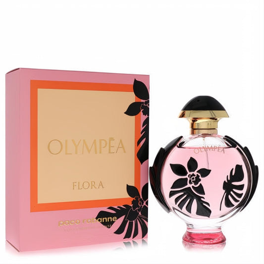 Luxurious Olympea Flora EDP Intense. Clear bottle with pink liquid, black floral design, gold cap, and elegant pink box.