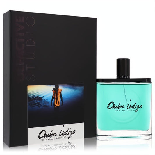 Olfactive Studio Ombre Indigo 3.4 oz unisex EDP. Vibrant turquoise perfume in sleek glass bottle with elegant black box.