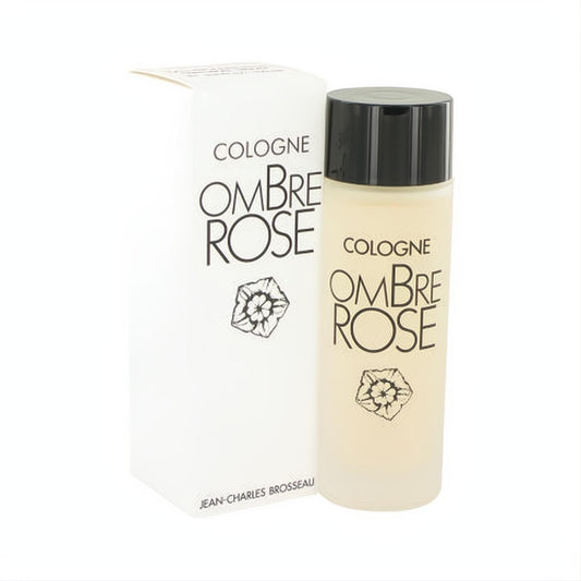 Luxurious Ombre Rose by Brosseau cologne spray in a frosted glass bottle with a black cap, beside its elegant white branded box.