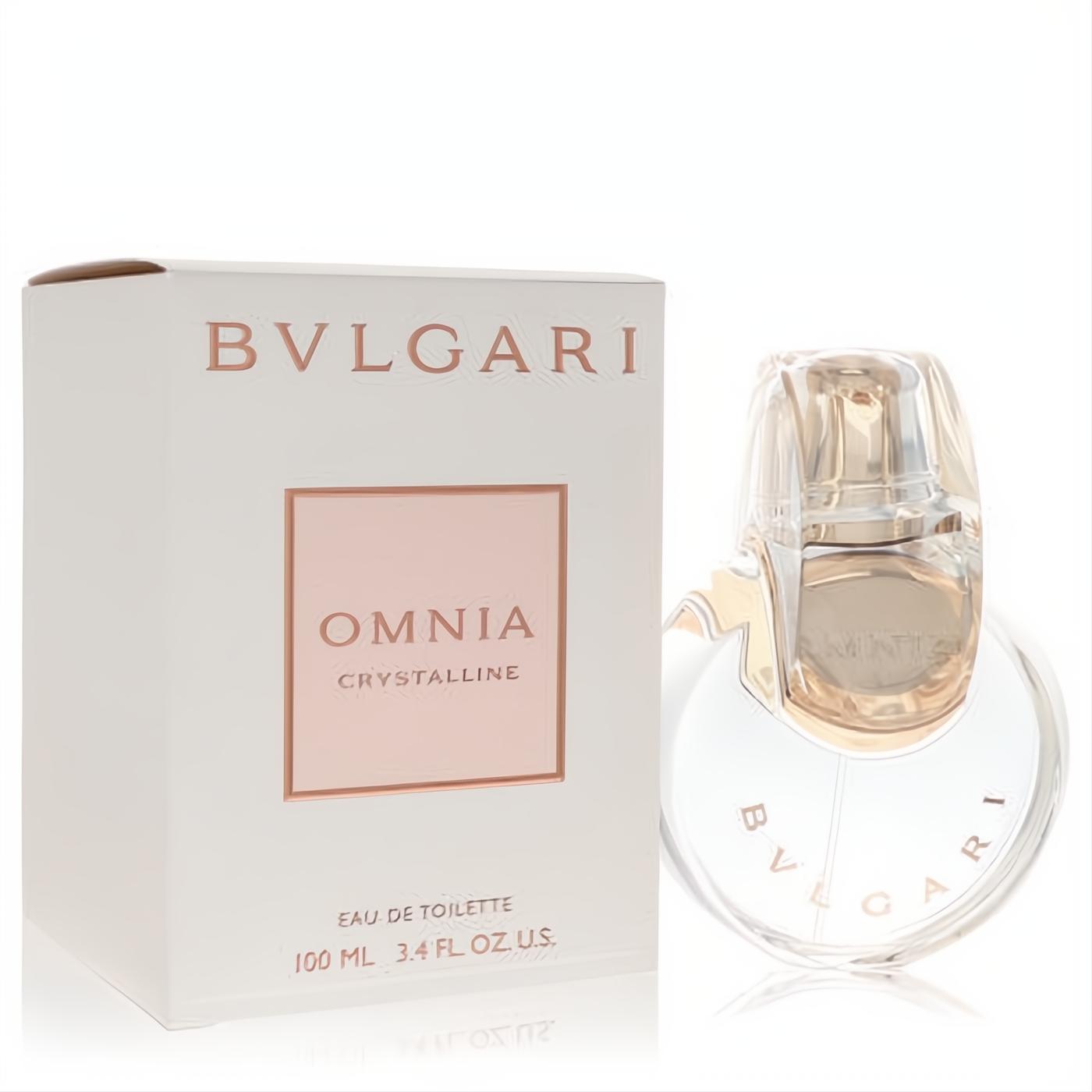 Luxurious Bvlgari Omnia Crystalline 3.4 oz EDT spray. Clear glass bottle with unique interlocking design and rose gold accents, next to its elegant white box.