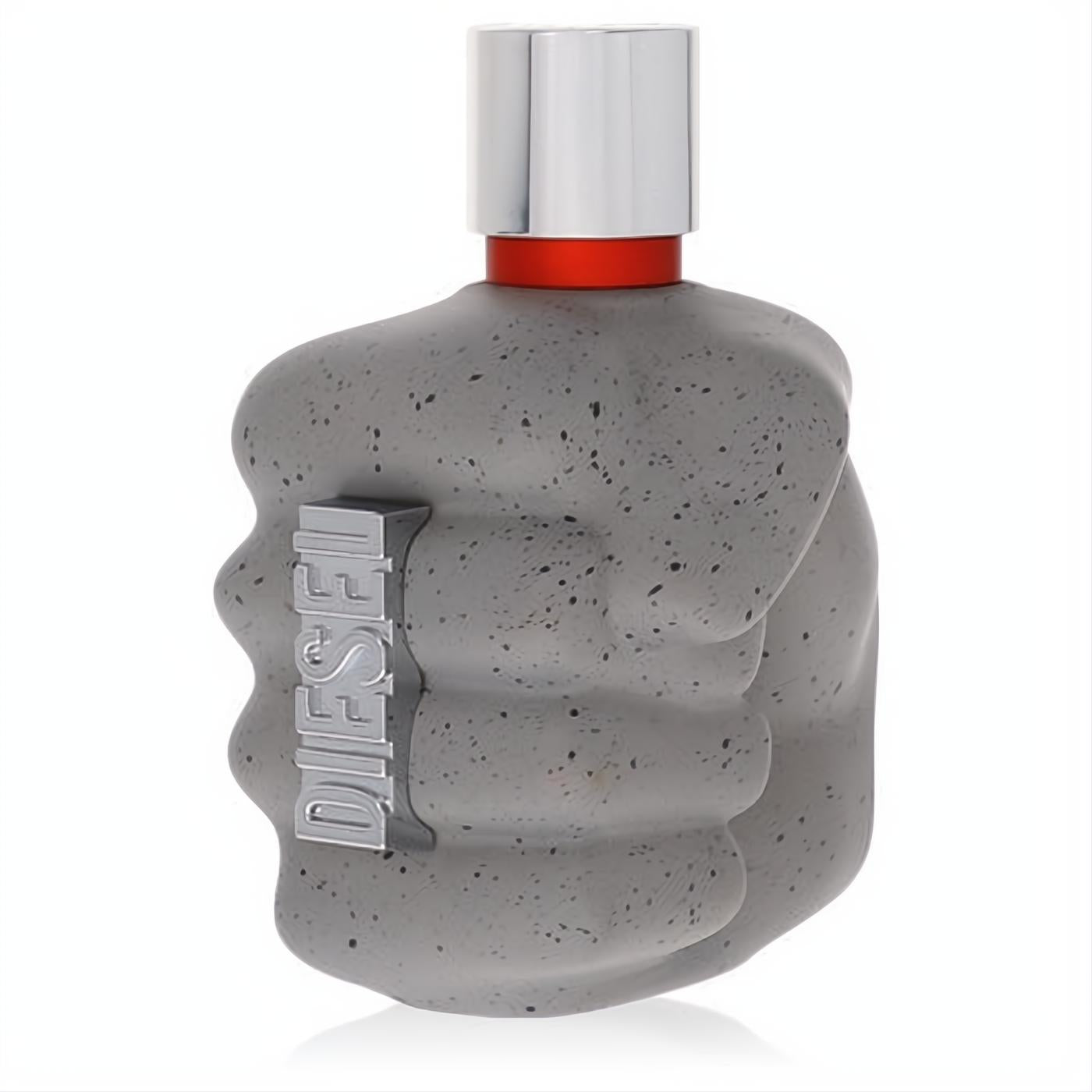 Diesel Only the Brave Street men's cologne bottle, a bold grey speckled concrete fist with silver cap and red band.