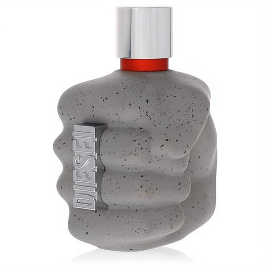 Diesel Only the Brave Street men's cologne bottle, a bold grey speckled concrete fist with silver cap and red band.