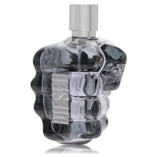 Bold Diesel Only the Brave men's fragrance in a striking clear glass fist bottle with a sleek silver cap, showcasing its unique design.