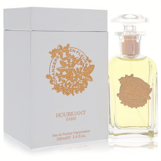 Luxurious Orangers En Fleurs 3.4 oz EDP. White box with vibrant gold floral design, clear glass bottle holding pale yellow perfume.